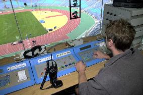 Technician adjusts new timing system for Olympics